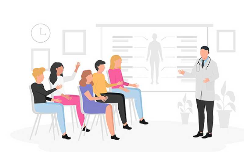 Réunion avec personnages assis et un professionnel de santé qui explique en projetant des éléments sur un écran